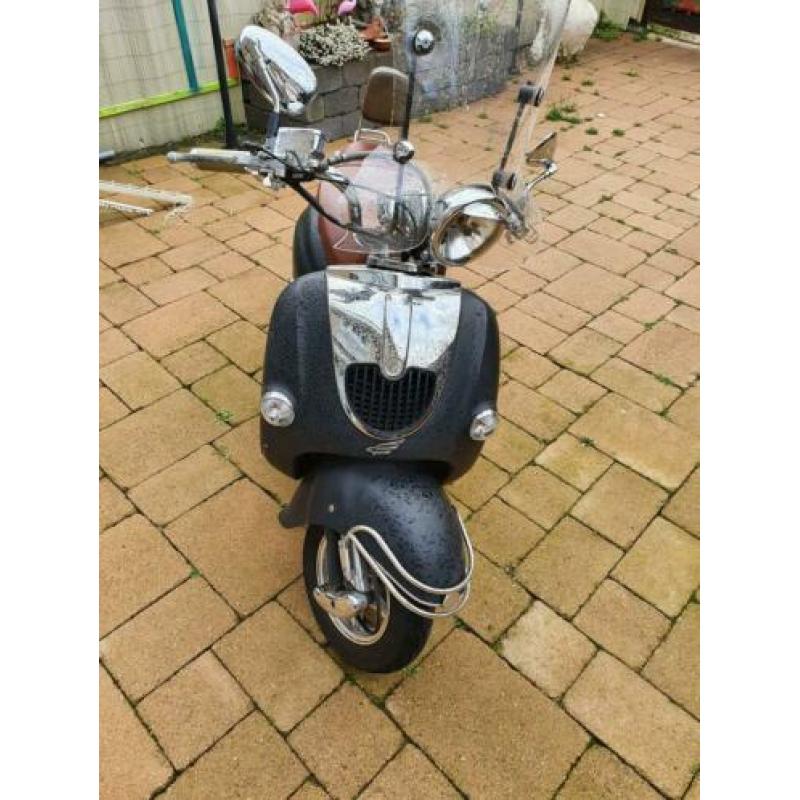 Scooter met windscherm